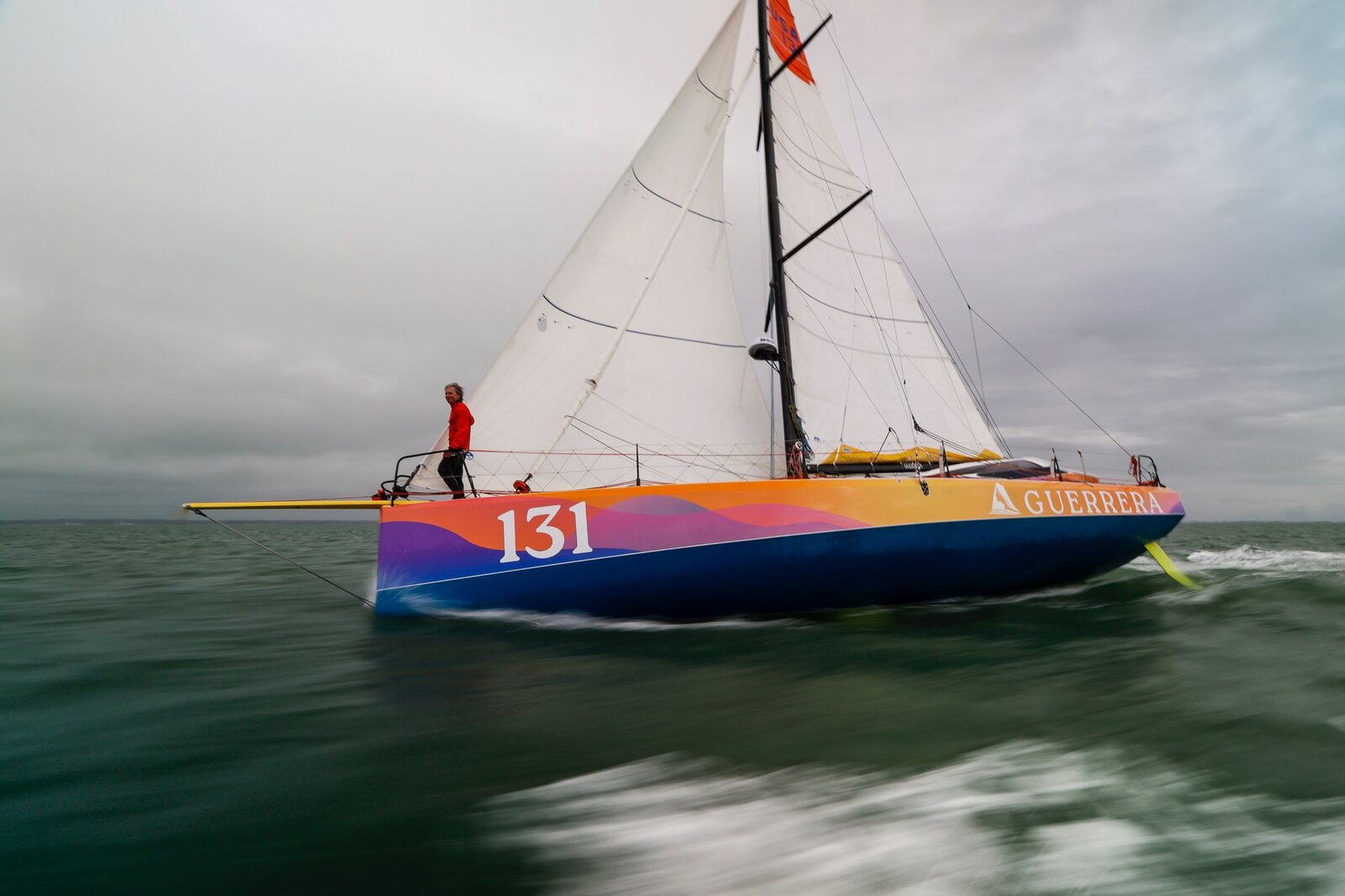 Guerrera under sail in the Solent, number 131 on her bow, Rufus standing at the bow