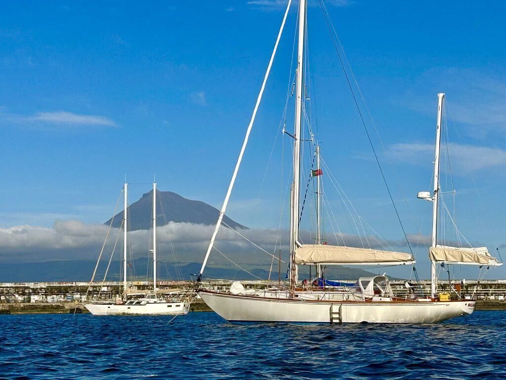 Malabar anchored off Pico, Azores, with the volcano behind her